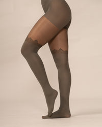 Olive tights with lace details on a beige background